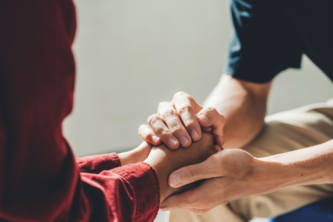 Man holding a woman's hand for warm,